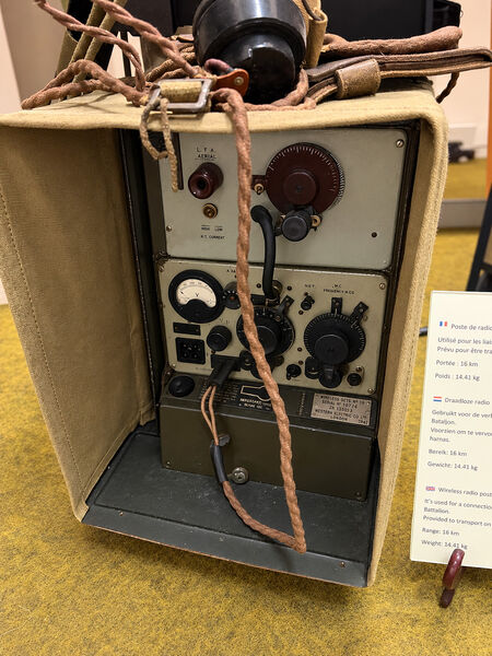 Wireless Set No. 18 in its open canvas carrying case, with dials, switches and a coiled cable on the front panel